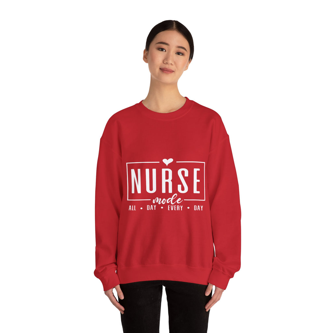 Woman wearing a red sweatshirt with 'Nurse Mode All Day Every Day' printed in white text, and hands on her waistband. Stylish design perfect for Nurses Week Custom Shirt Suggestions.