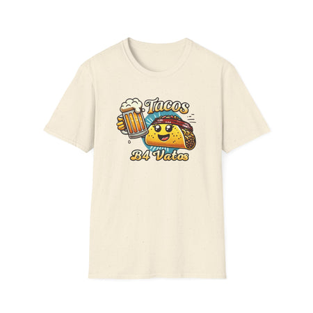 T-shirt featuring a fun 'Tacos B4 Vatos' design with a smiling taco character wearing a bandana and holding a beer mug. Perfect for taco lovers who prioritize food and fun with a playful style.