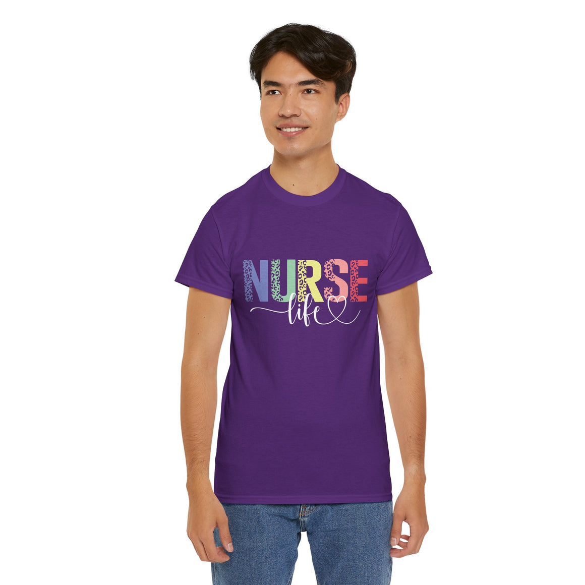 Smiling man wearing a purple t-shirt with a colorful 'Nurse Life' design, showcasing nurse life t-shirt nurse week ideas for a stylish and professional look.