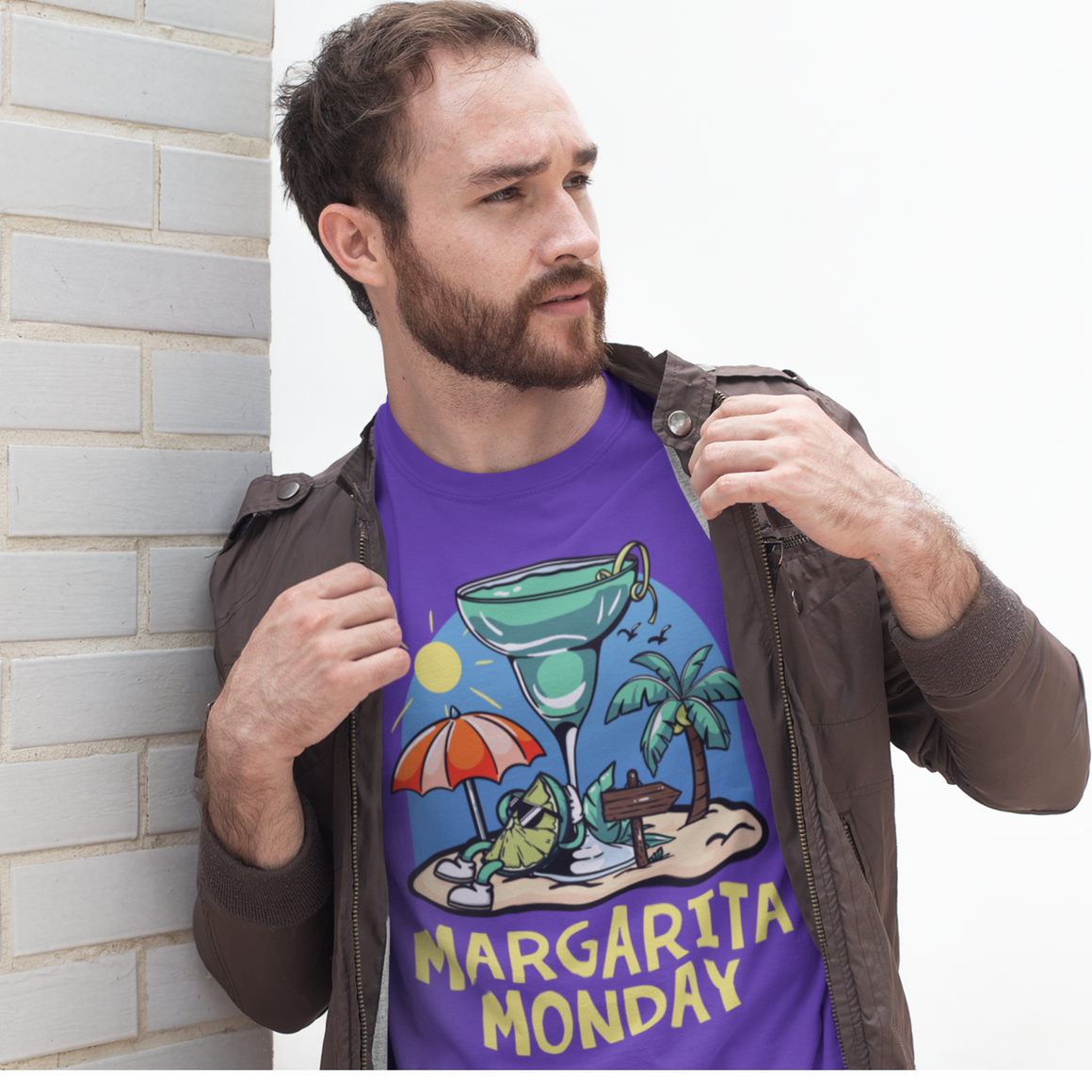 Margarita Monday T-shirt Design Ideas featuring a purple t-shirt with a tropical-themed design of a margarita glass, sun umbrella, palm trees, and a beach scene, paired with bold yellow text reading 'Margarita Monday.' Perfect for celebrating fun and relaxing vibes in style.