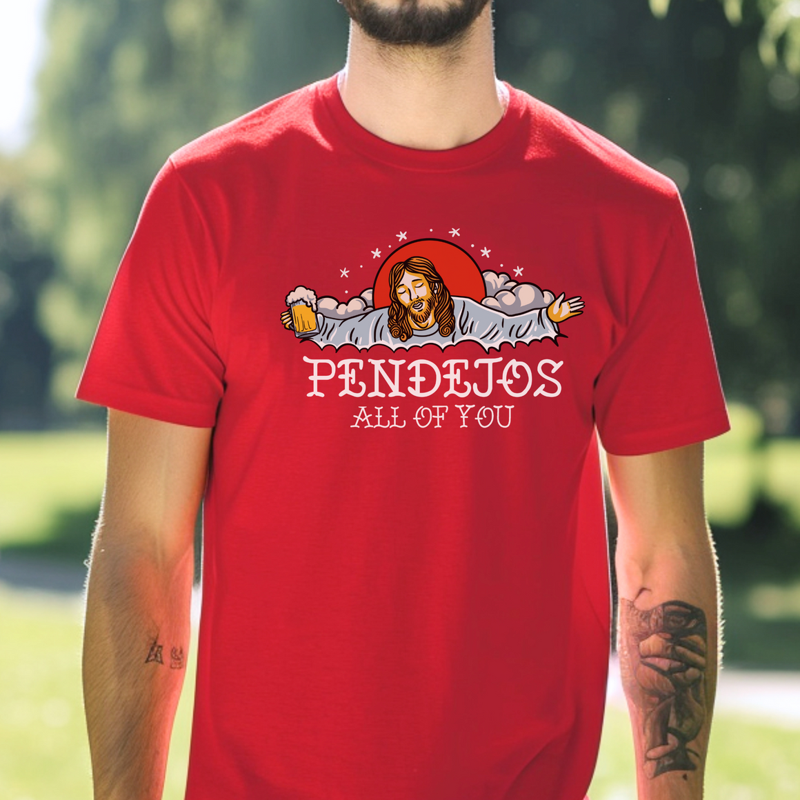 A person wearing a red t-shirt featuring a grumpy pug illustration with the text "SOME PEOPLE GIVE ME HEADACHES." They are sitting indoors, styled with long hair and a cozy cardigan.