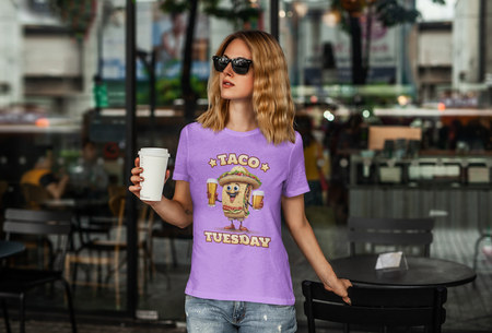 Light Purple T-shirt with a fun 'Taco Tuesday' design featuring a smiling taco character holding two beers, ready to celebrate. Perfect for taco enthusiasts who enjoy Taco Tuesday with a playful twist.