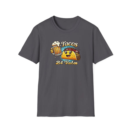 T-shirt featuring a fun 'Tacos B4 Vatos' design with a smiling taco character wearing a bandana and holding a beer mug. Perfect for taco lovers who prioritize food and fun with a playful style.