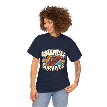 Funny Mexican t-shirt featuring the phrase 'Chancla Survivor. Navy Blue t-shirt featuring a retro-inspired 'Chancla Survivor' design with a graphic of a traditional sandal. Perfect for those with a sense of humor about family discipline and nostalgic cultural references.