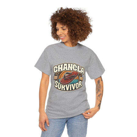 Funny Mexican t-shirt featuring the phrase 'Chancla Survivor. T-shirt featuring a retro-inspired 'Chancla Survivor' design with a graphic of a traditional sandal. Perfect for those with a sense of humor about family discipline and nostalgic cultural references.