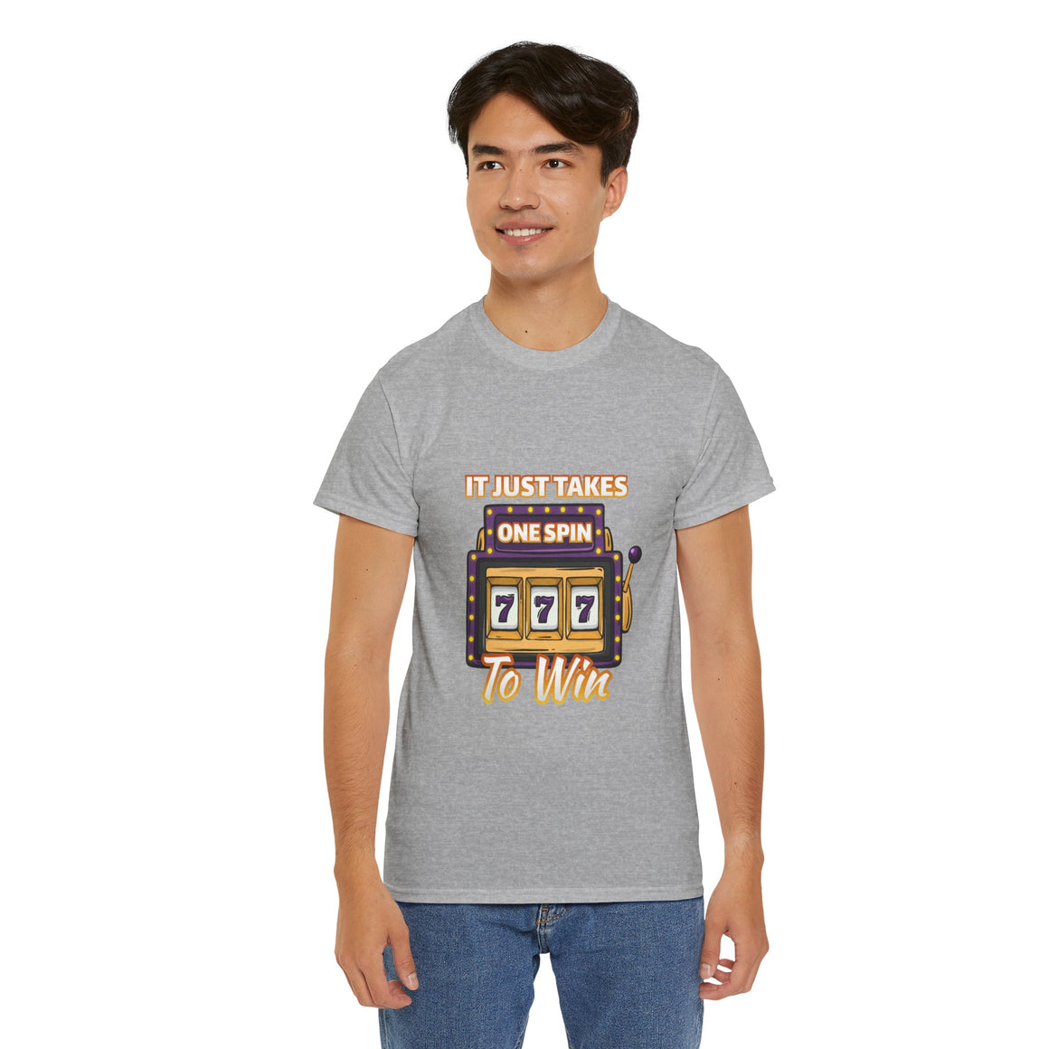 Person wearing a grey t-shirt with the text "It Just Takes One Spin To Win" and a slot machine showing triple sevens. This shirt is one of the humorous casino-inspired shirts, perfect for anyone who enjoys a touch of gambling humor and the excitement of casino games.