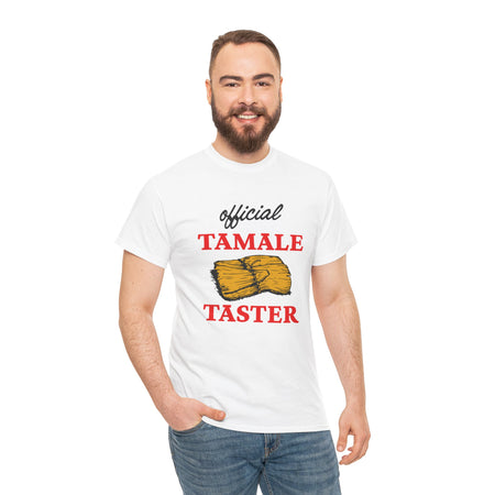 Smiling man wearing a white T-shirt with bold red text 'Official Tamale Taster' and a tamale graphic, perfect for funny Christmas shirts and holiday gatherings.