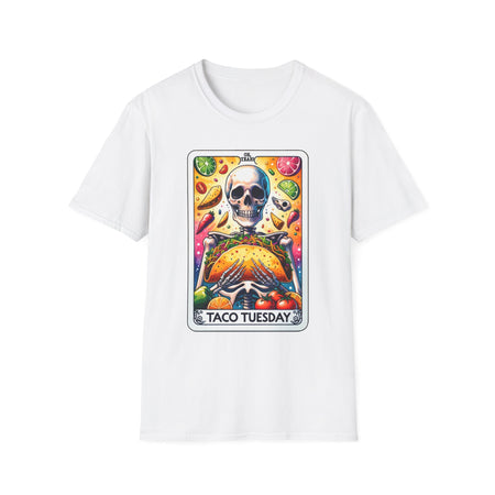 White T-shirt with a unique 'Taco Tuesday' design featuring a skeleton holding a large taco, surrounded by vibrant ingredients like lime slices, chili peppers, and tomatoes. Perfect for those who enjoy a fun, slightly edgy take on Taco Tuesday.