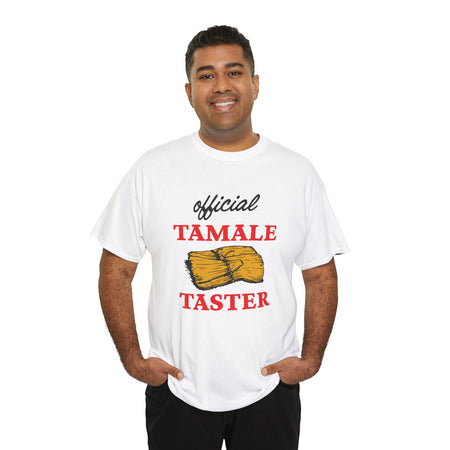 Smiling man wearing a white T-shirt with bold red text 'Official Tamale Taster' and a tamale graphic, perfect for funny Christmas shirts and holiday gatherings.