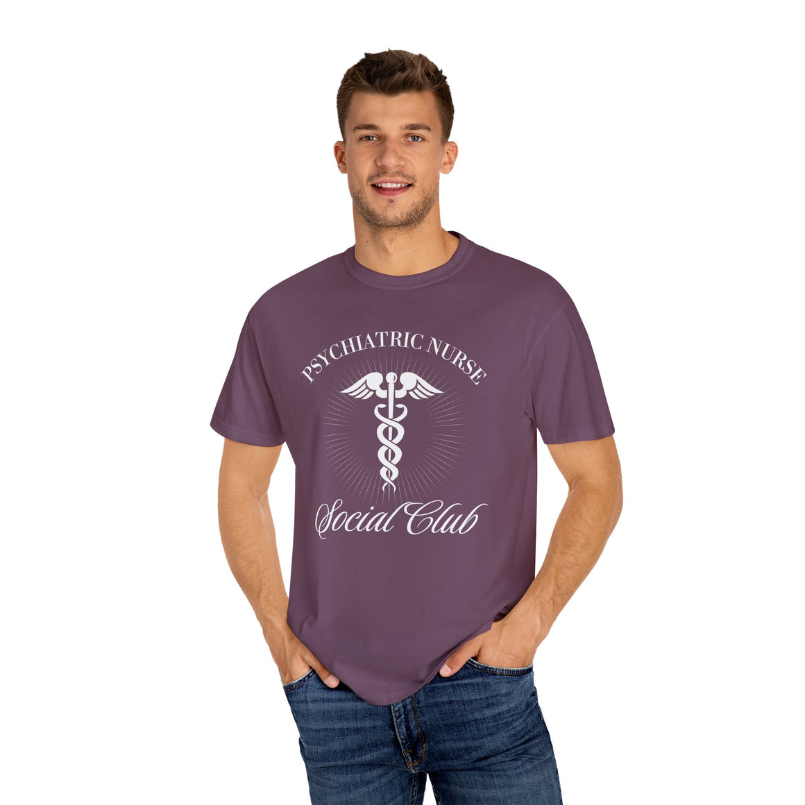 A nurse standing wearing a shirt that says Psychiatric Nurse Social Club and has a grapgic of a nurses caduceus