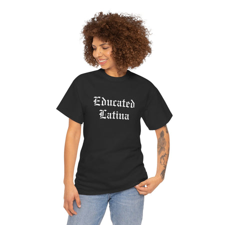 Confident woman with tattoos wearing a black t-shirt with 'Educated Latina' in bold old English font. This shirt represents educated Latina T-shirt sayings and quotes, celebrating Latina pride, strength, and cultural identity. Perfect for those who embrace their heritage with a bold and stylish look.