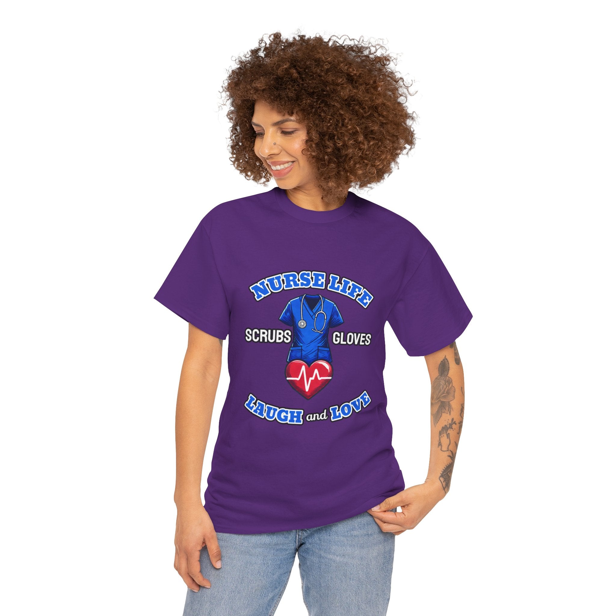 A smiling woman wearing a purple T-shirt with the design "Nurse Life - Scrubs, Gloves, Laugh and Love," featuring a stethoscope and heart symbol. This shirt is part of a Nurse Week clothing gift collection, ideal for nurses to celebrate and showcase their dedication. Perfect for Nurse Week clothing gifts for nurses.