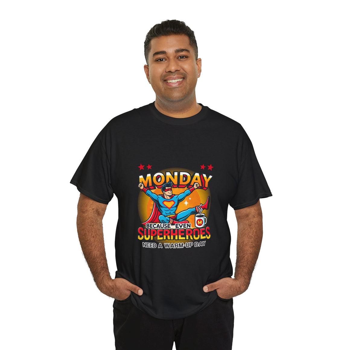 a Man wearing a black t-shirt with a humorous design featuring a superhero and the text 'Monday - Because Even Superheroes Need a Warm-Up Day.' A playful option in funny t-shirts for adults.