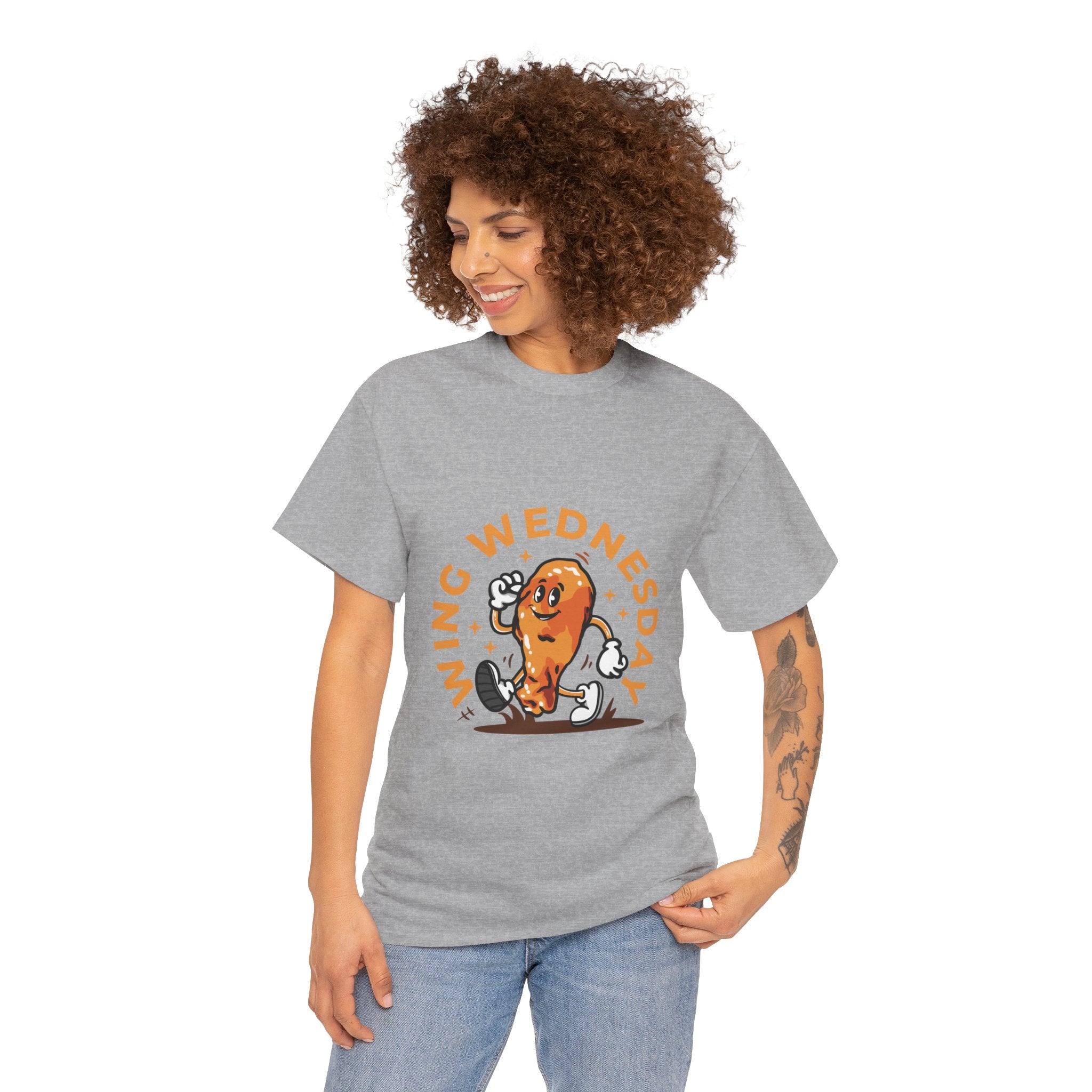 T-shirt featuring a fun 'Wing Wednesday' design with a cartoon-style chicken wing character in motion. Perfect for food lovers and those who enjoy celebrating Wing Wednesday in style.