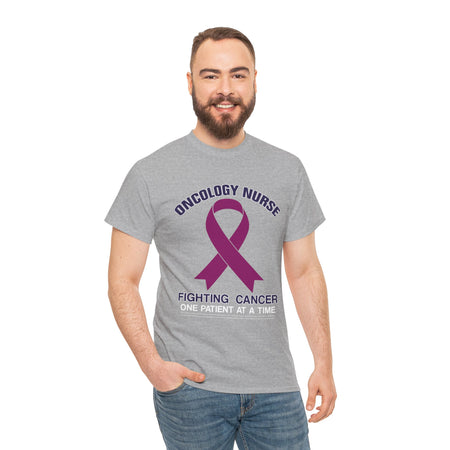 Close-up of a nurse wearing a slate greyt-shirt with the words 'Oncology Nurse' and 'Fighting Cancer One Patient at a Time' alongside a purple cancer ribbon. This design is part of the oncology nurse t-shirt designs collection, symbolizing strength and dedication to patient care.
