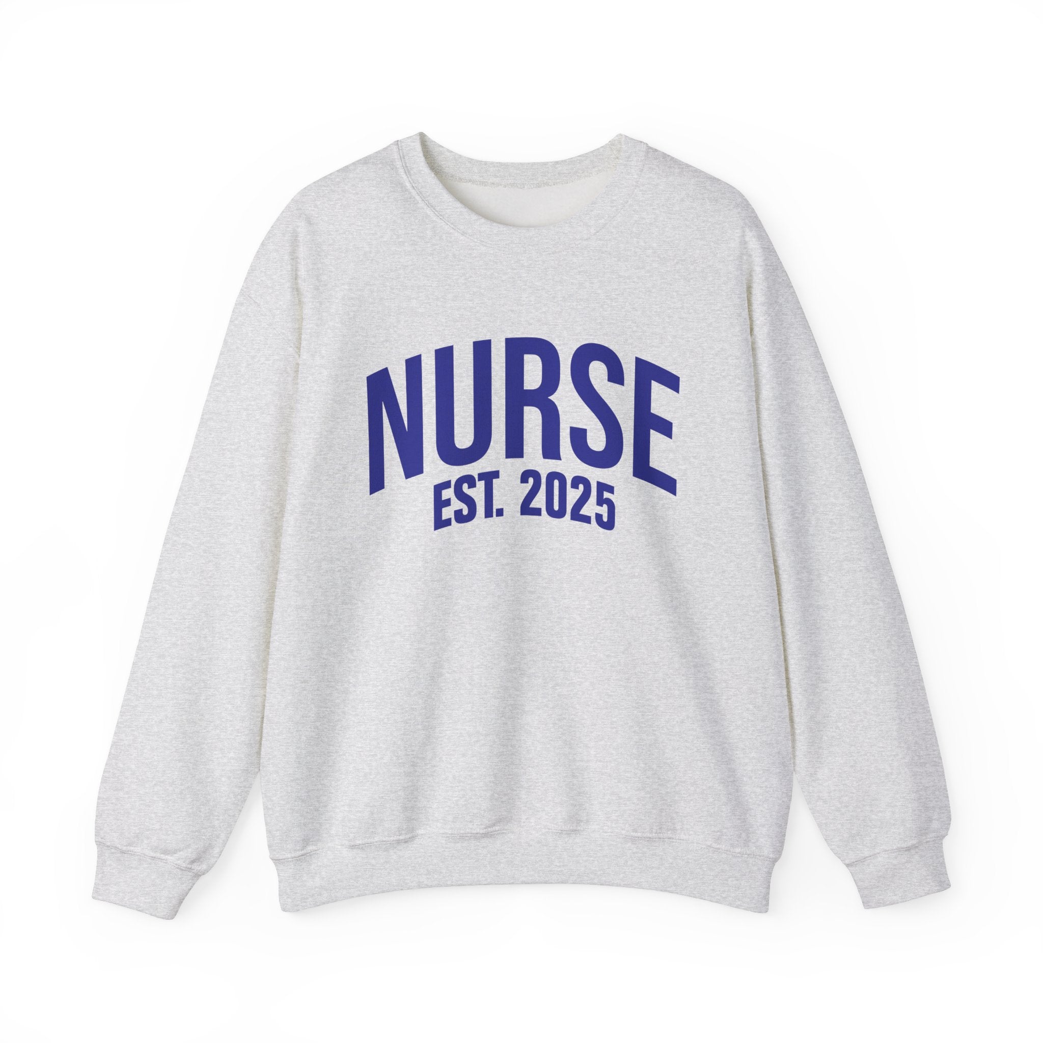 A white sweatshirt with bold blue text reading "NURSE EST. 2025." He stands confidently against a plain white background, smiling slightly. The sweatshirt design highlights the keyphrase "Nurse Est. 2025," making it a stylish and comfortable option for nursing students, graduates, or future nurses.