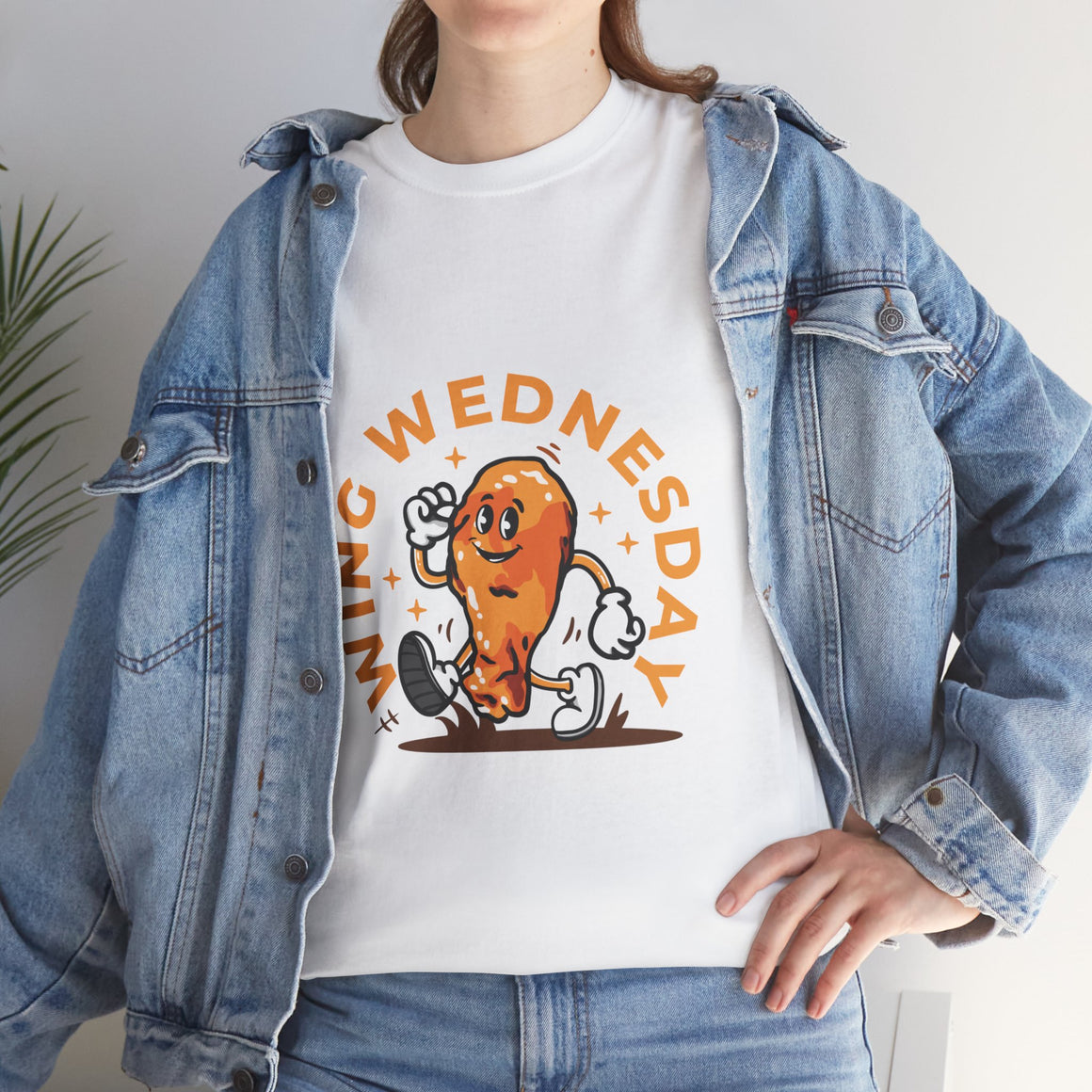 White T-shirt featuring a fun 'Wing Wednesday' design with a cartoon-style chicken wing character in motion. Perfect for food lovers and those who enjoy celebrating Wing Wednesday in style.