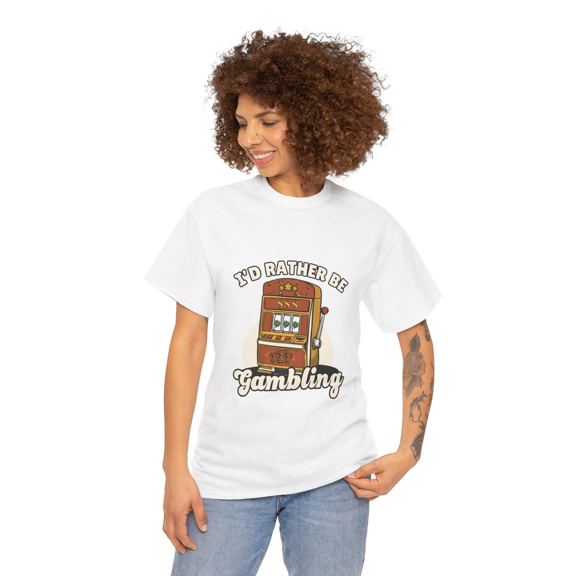 Person wearing a white t-shirt with the text "I'd Rather Be Gambling" and an illustration of a slot machine. This funny casino game shirt is perfect for anyone who loves gambling humor and casino-inspired designs