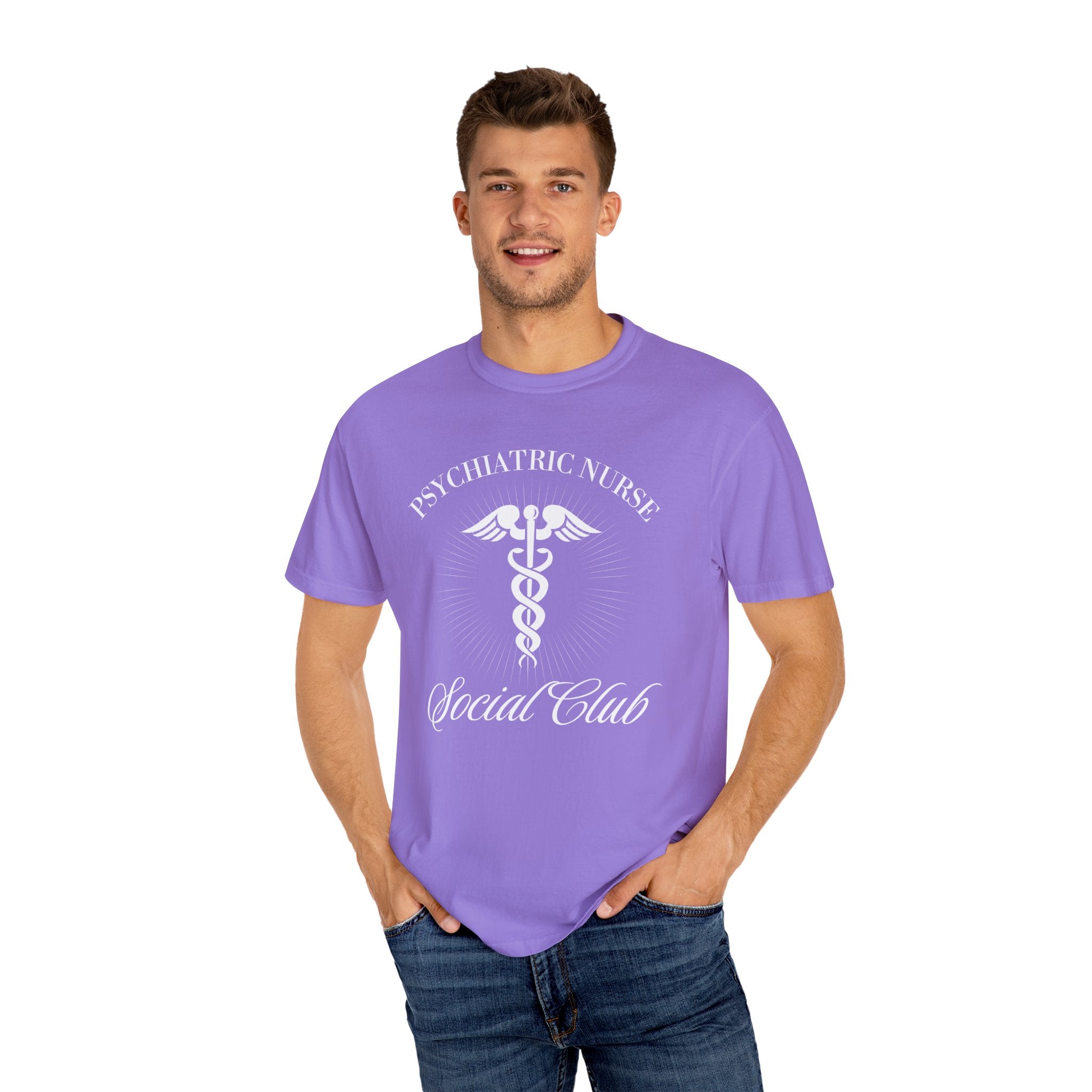 A nurse standing wearing a shirt that says Psychiatric Nurse Social Club and has a grapgic of a nurses caduceus