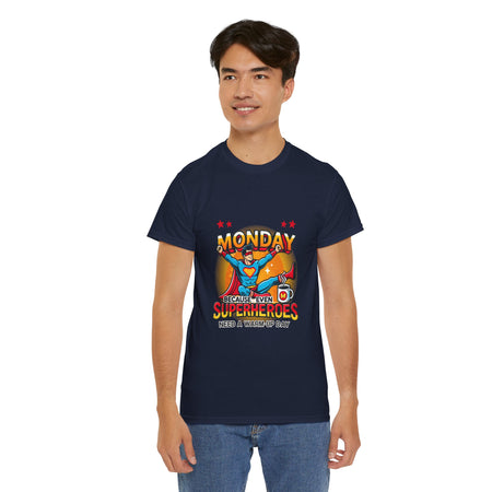 a Man wearing a Royal Blue t-shirt with a humorous design featuring a superhero and the text 'Monday - Because Even Superheroes Need a Warm-Up Day.' A playful option in funny t-shirts for adults.