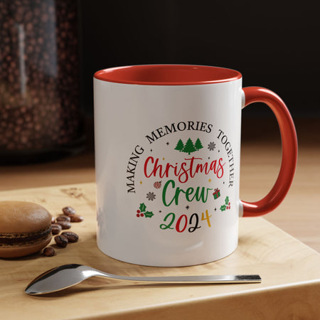 A white Festive Christmas Coffee Cup featuring a colorful "Christmas Crew 2024" design. The text reads "Making Memories Together" with holiday-themed icons, including Christmas trees, snowflakes, holly, and a small gift box. This cheerful cup is perfect for spreading holiday cheer and enjoying warm drinks during the festive season.