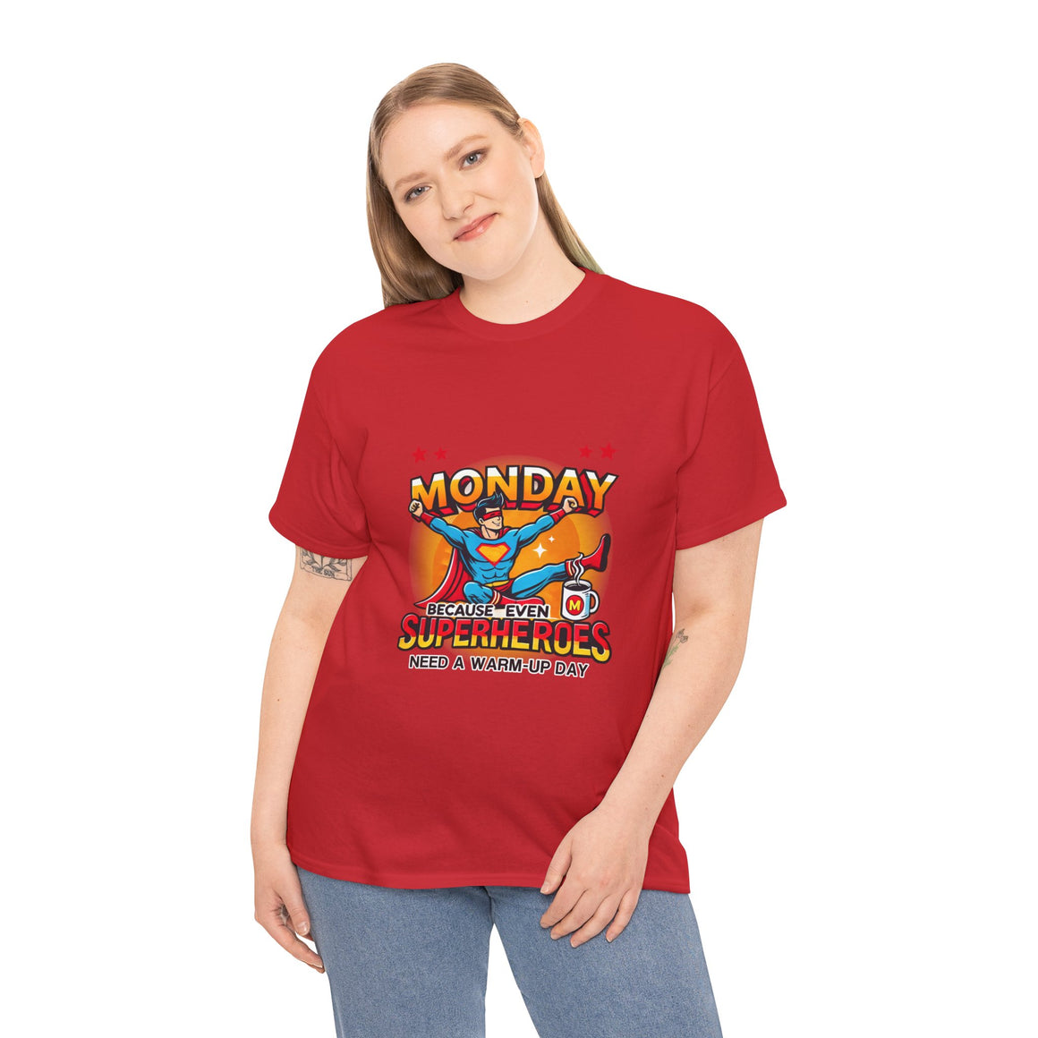 a woman wearing a Red t-shirt with a humorous design featuring a superhero and the text 'Monday - Because Even Superheroes Need a Warm-Up Day.' A playful option in funny t-shirts for adults.