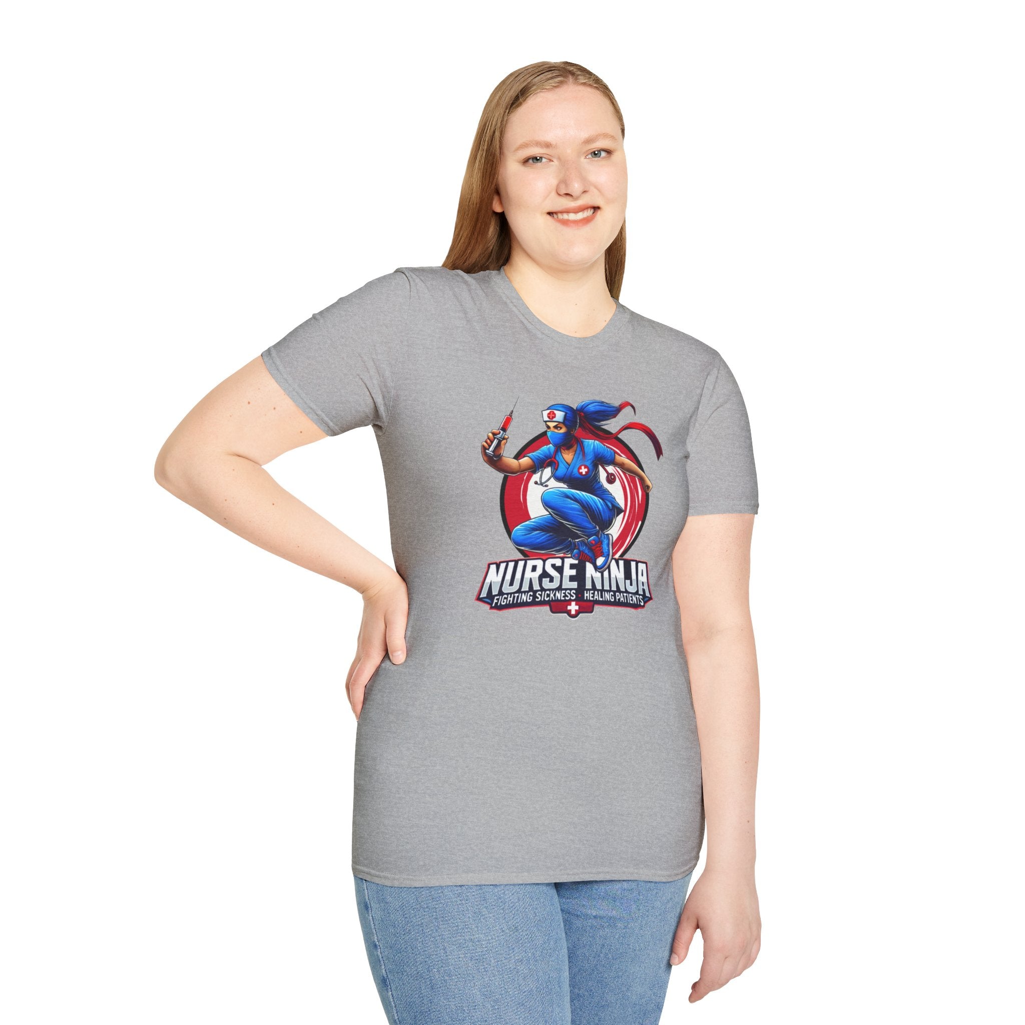 A light grey T-shirt  featuring one of the Nurse Ninja t-shirt designs, depicting a dynamic nurse dressed as a ninja holding a syringe. The graphic includes the text "Nurse Ninja - Fighting Sickness, Healing Patients," showcasing a bold and heroic theme, perfect for healthcare professionals.