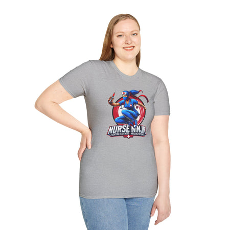 A light grey T-shirt  featuring one of the Nurse Ninja t-shirt designs, depicting a dynamic nurse dressed as a ninja holding a syringe. The graphic includes the text "Nurse Ninja - Fighting Sickness, Healing Patients," showcasing a bold and heroic theme, perfect for healthcare professionals.