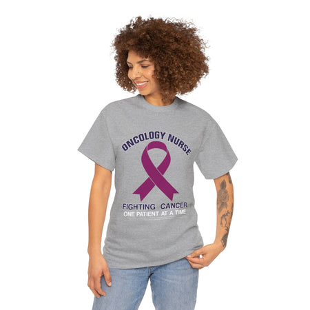 Close-up of a nurse wearing a slate greyt-shirt with the words 'Oncology Nurse' and 'Fighting Cancer One Patient at a Time' alongside a purple cancer ribbon. This design is part of the oncology nurse t-shirt designs collection, symbolizing strength and dedication to patient care.
