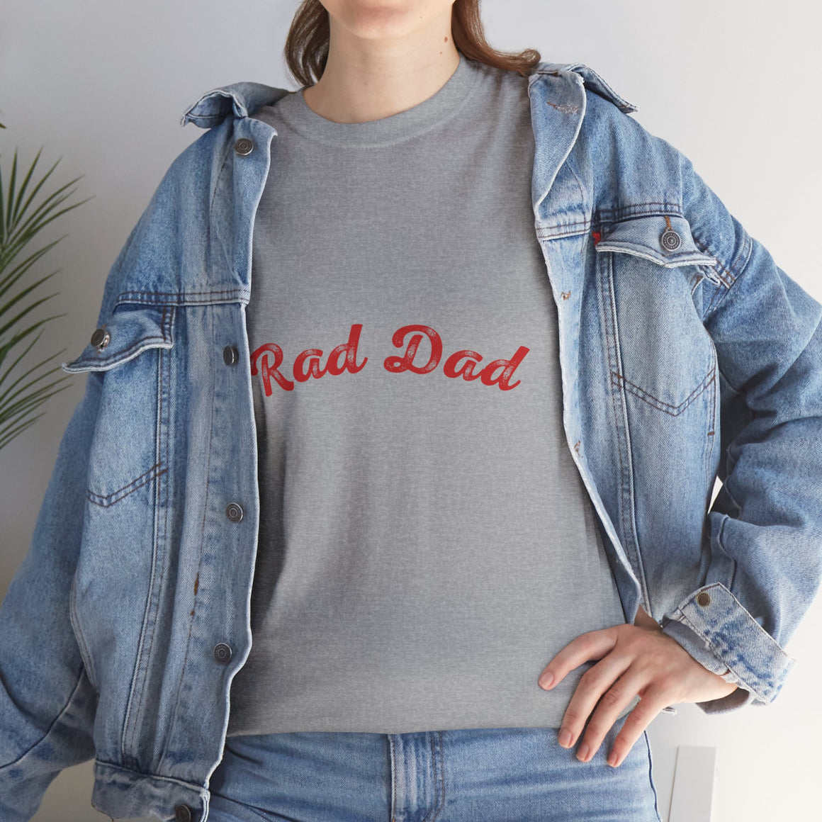 A Man standing ooutside wearing a t shirt with a Red Rad Dad Graphic on the front