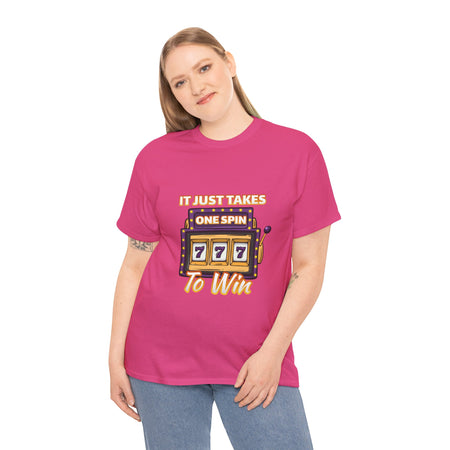 Person wearing a hot pink t-shirt with the text "It Just Takes One Spin To Win" and a slot machine illustration showing triple sevens. This is one of the popular gambling style shirts funny and perfect for anyone who loves casino humor and the thrill of winning.