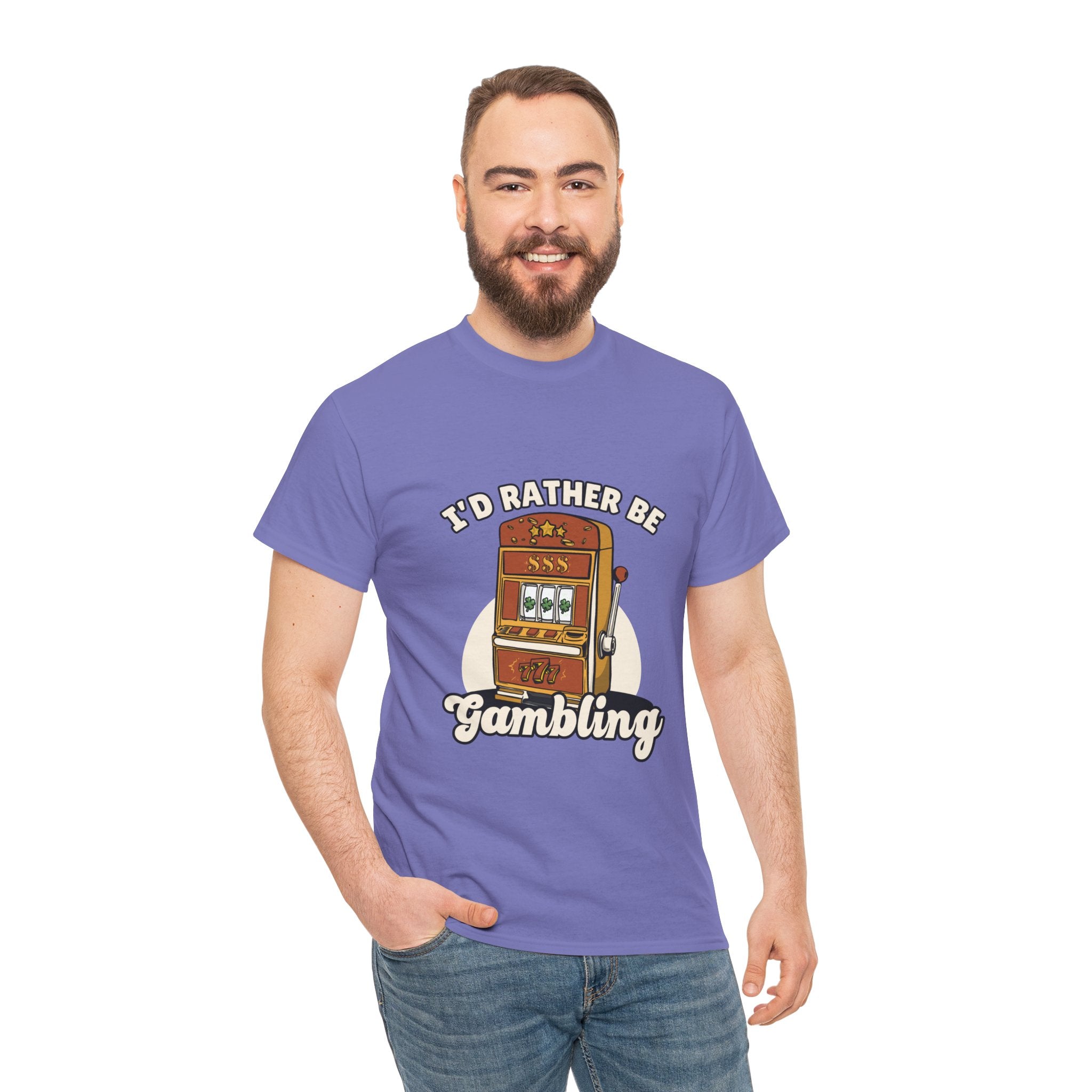 Person wearing a light purple t-shirt with the text "I'd Rather Be Gambling" and an illustration of a slot machine. This Funny Gambling themed shirts is perfect for anyone who loves gambling humor and casino-inspired designs