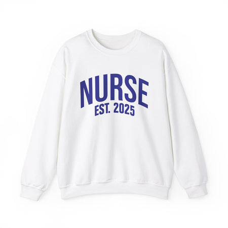 A white sweatshirt with bold blue text reading "NURSE EST. 2025." He stands confidently against a plain white background, smiling slightly. The sweatshirt design highlights the keyphrase "Nurse Est. 2025," making it a stylish and comfortable option for nursing students, graduates, or future nurses.