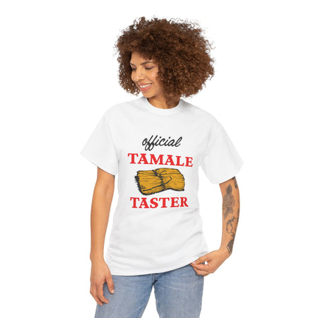 Smiling woman wearing a white T-shirt with bold red text 'Official Tamale Taster' and a tamale graphic, perfect for funny Christmas shirts and holiday gatherings.