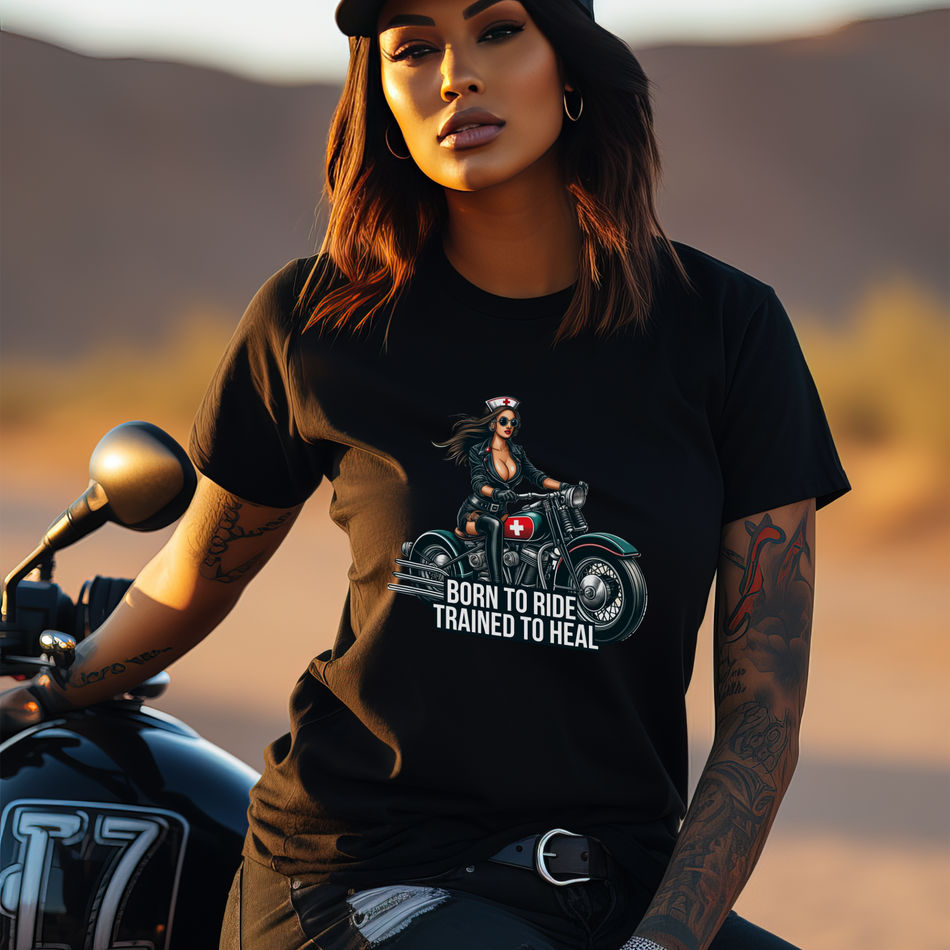 Sexy Nurse Biker t-shirt featuring a striking graphic of a nurse in a leather jacket riding a motorcycle, accented with a red cross emblem and the phrase 'Born to Ride, Trained to Heal.' Ideal for healthcare professionals who embrace adventure and style.