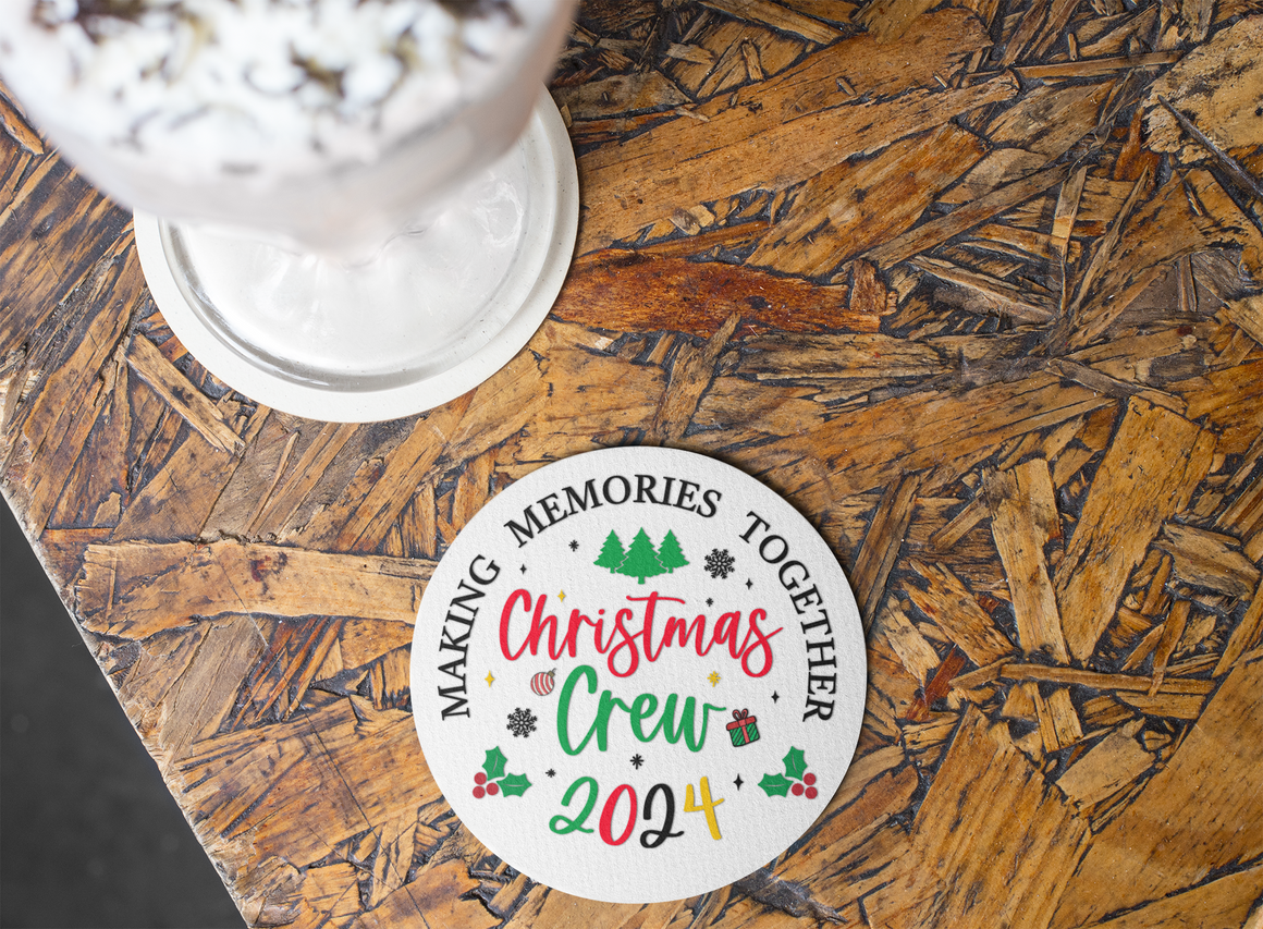 Christmas Crew 2024 ceramic coaster with festive design featuring trees, holly, snowflakes, and gift icons. Text reads 'Making Memories Together,' ideal for holiday gatherings, Christmas parties, and seasonal decor. Perfect for adding a cheerful touch to holiday tables and drinkware.