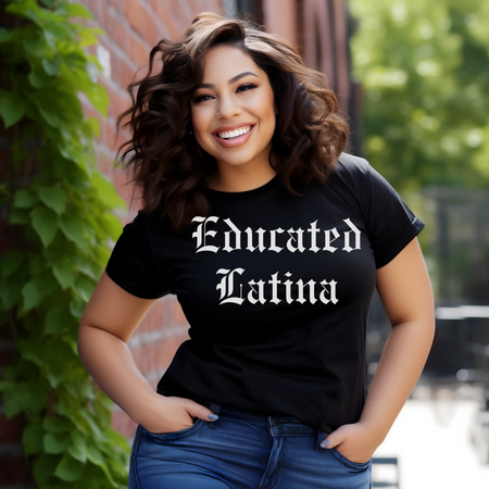 Smiling woman standing outdoors, wearing a black t-shirt with 'Educated Latina' in bold old English font. This shirt showcases educated Latina T-shirt sayings and quotes, celebrating Latina empowerment and cultural pride. Ideal for Latinx individuals who embrace their heritage with style and confidence.