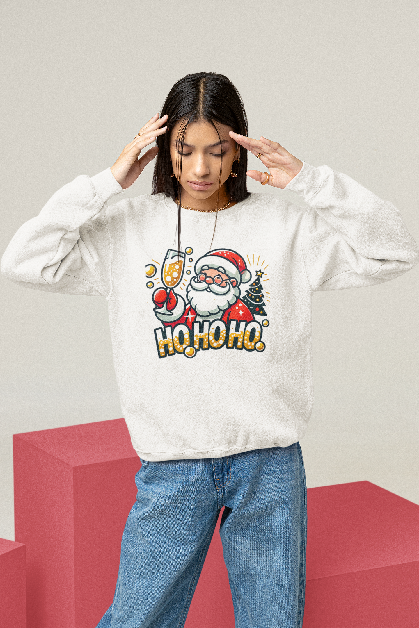 White Christmas sweatshirt featuring a cheerful Santa holding a champagne glass, next to a decorated Christmas tree and the festive text 'Ho Ho Ho.' A fun holiday sweatshirt perfect for adding Christmas cheer to any celebration.