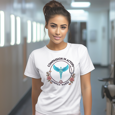 White hospice nurse t-shirt featuring the phrase 'Compassion in Action' with a medical caduceus symbol, flowers, and stethoscope graphic. Ideal for hospice nurses who bring compassion and care to their work.