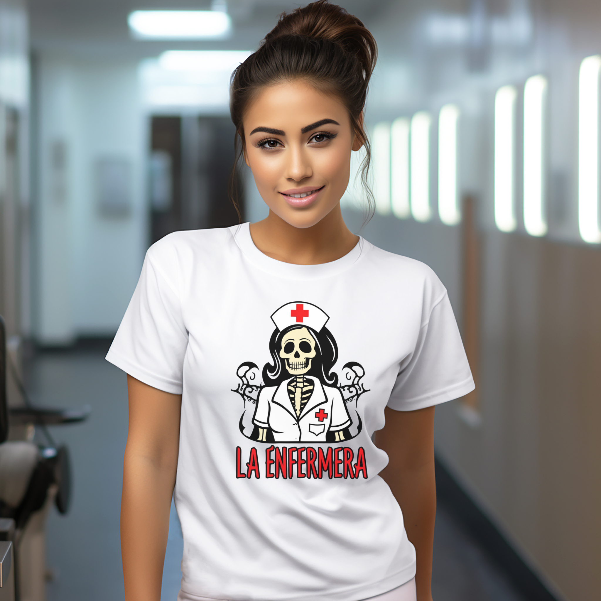 Smiling woman wearing a "La Enfermera Loteria Shirt" featuring a skeleton nurse in a white uniform with a red cross on the cap, standing in a brightly lit hallway. The design resembles a traditional loteria card with "La Enfermera" in bold red letters, perfect for Día de los Muertos and healthcare themes.