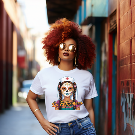A picture of a nurse wearing a t shirt with a graphic of the day of the dead nurse on the front and it reads La Enfermera