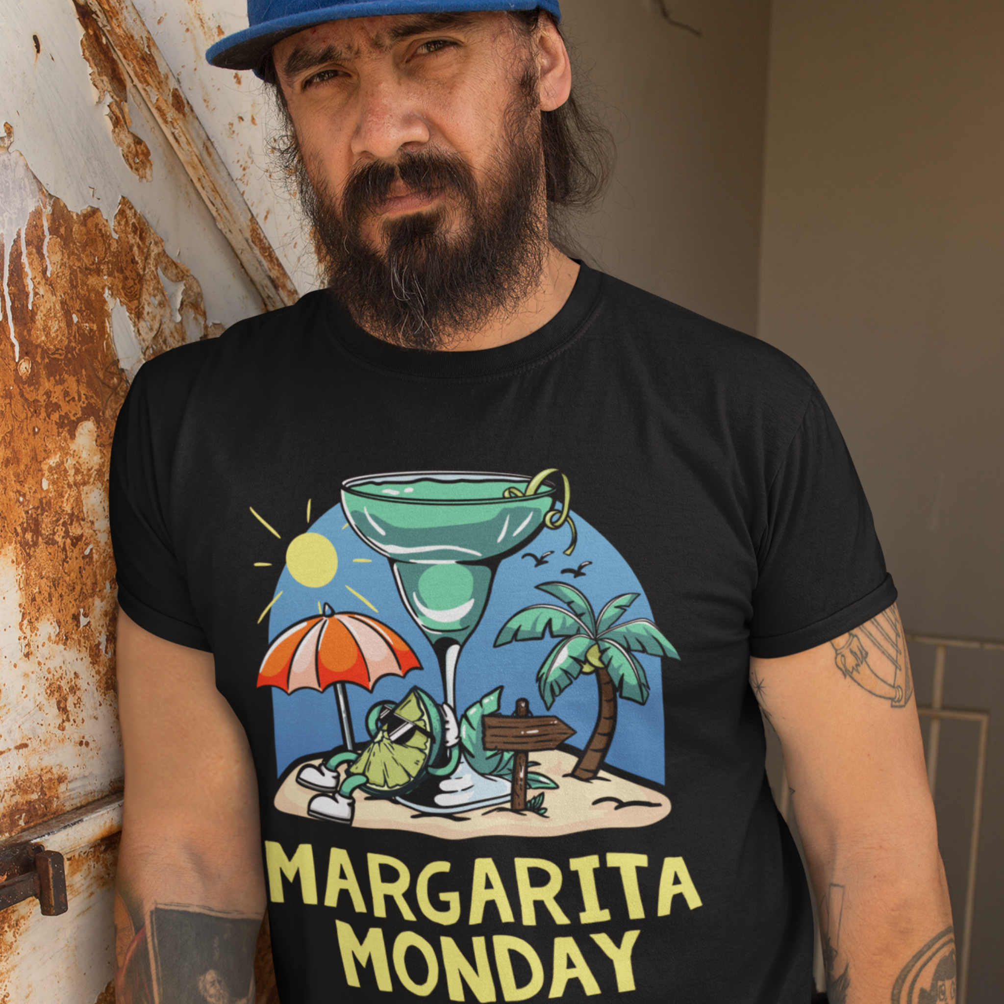 Man wearing a black t-shirt with a fun "Margarita Monday" design, showcasing tropical vibes with a large margarita glass, palm trees, and a beach scene. This image highlights creative Margarita Monday t-shirt design ideas, perfect for adding a touch of relaxation and celebration to casual outfits. The colorful artwork captures the spirit of a beach getaway, making this shirt a great choice for Margarita Monday fans.