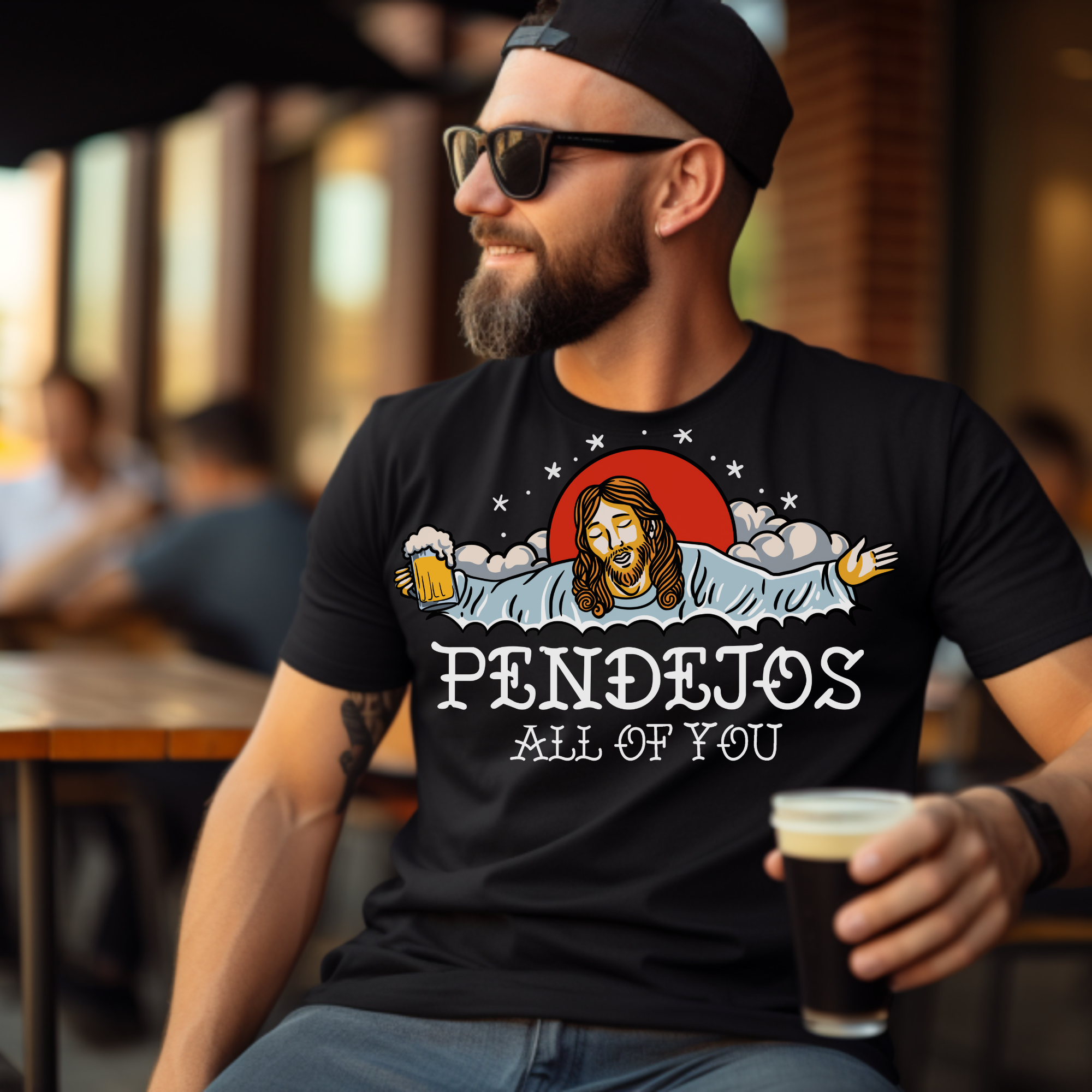 Black t-shirt featuring a humorous illustration with a relaxed figure holding a beer, accompanied by the bold text 'Pendejos All of You.' Ideal for those with a playful sense of humor and appreciation for edgy, lighthearted designs