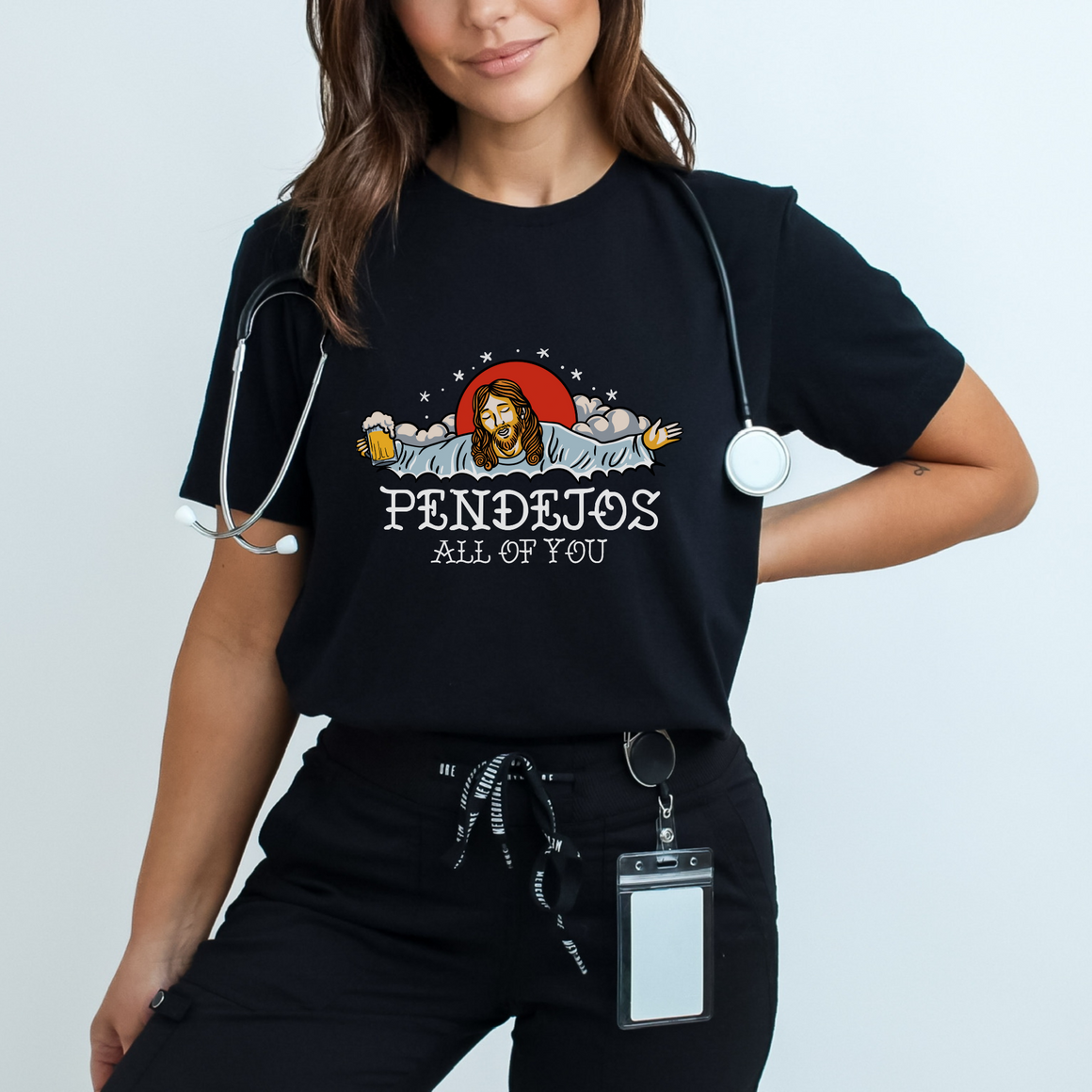 Black t-shirt featuring a humorous illustration with a relaxed figure holding a beer, accompanied by the bold text 'Pendejos All of You.' Ideal for those with a playful sense of humor and appreciation for edgy, lighthearted designs