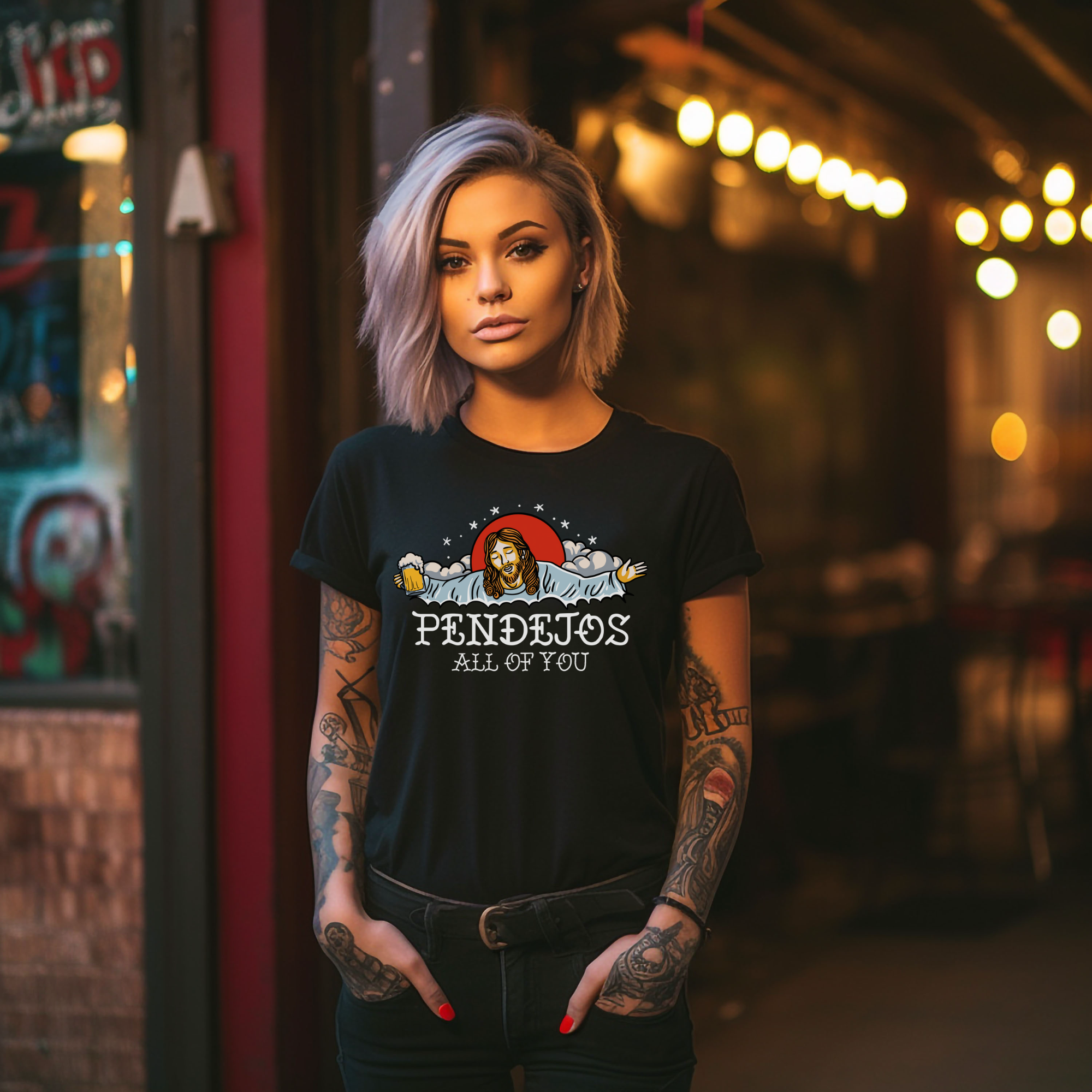 Black t-shirt featuring a humorous illustration with a relaxed figure holding a beer, accompanied by the bold text 'Pendejos All of You.' Ideal for those with a playful sense of humor and appreciation for edgy, lighthearted designs