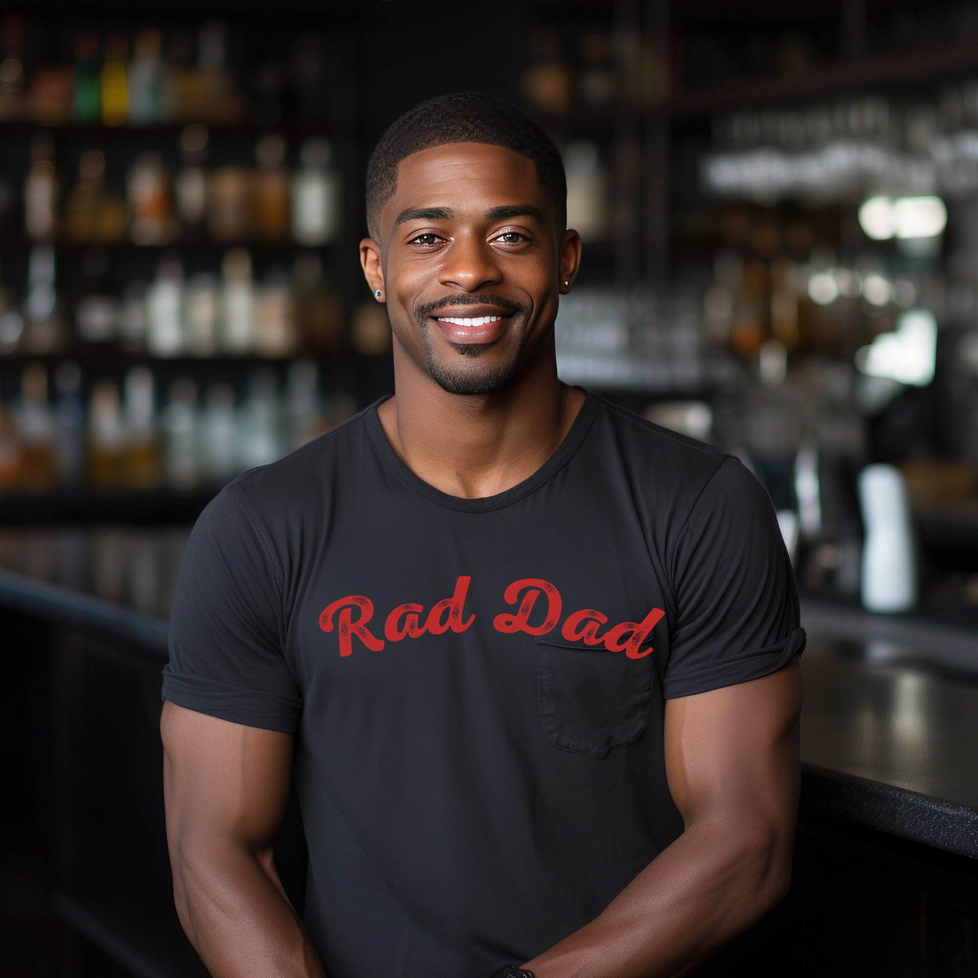 A Man standing ooutside wearing a t shirt with a Red Rad Dad Graphic on the front