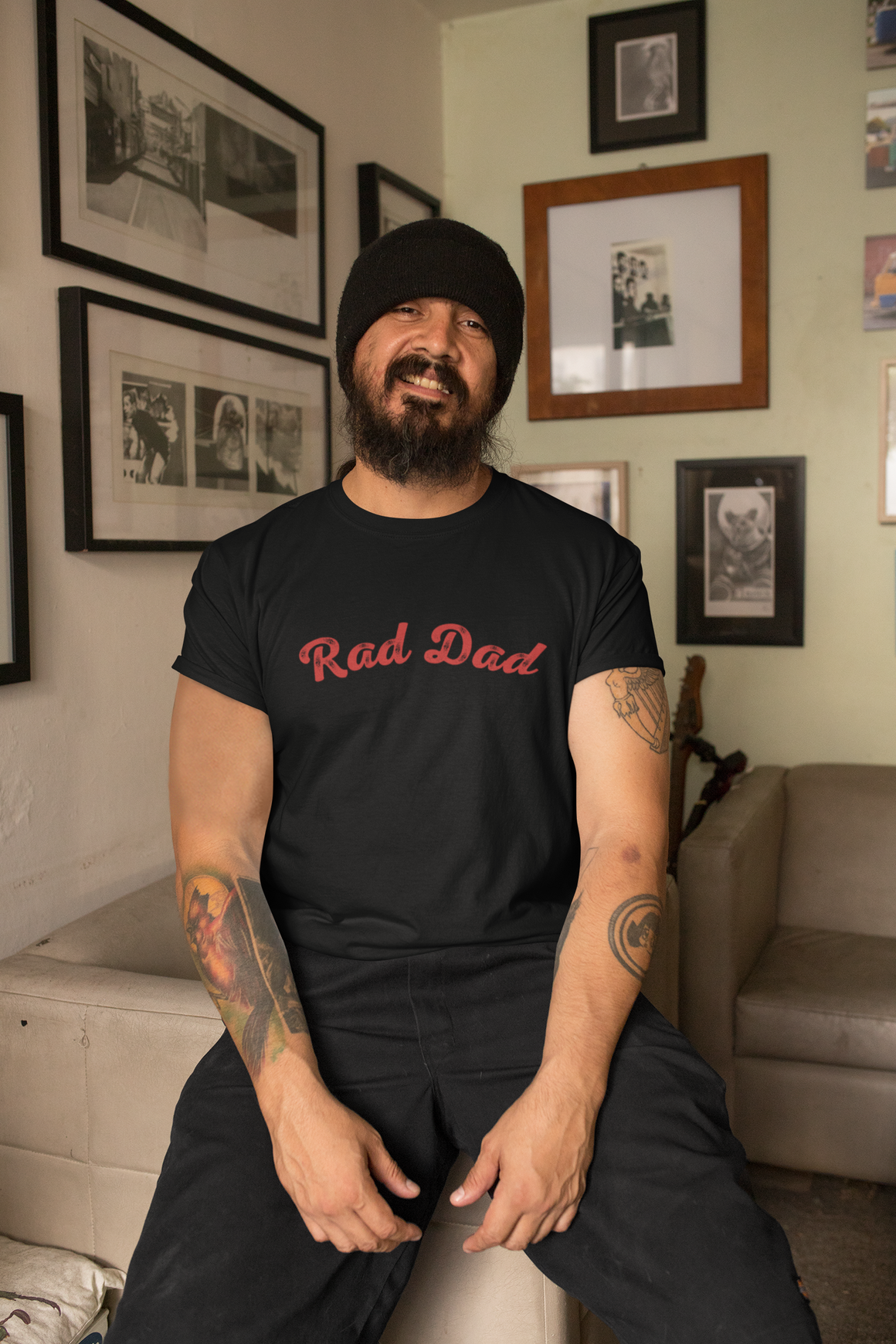 A Man standing ooutside wearing a t shirt with a Red Rad Dad Graphic on the front