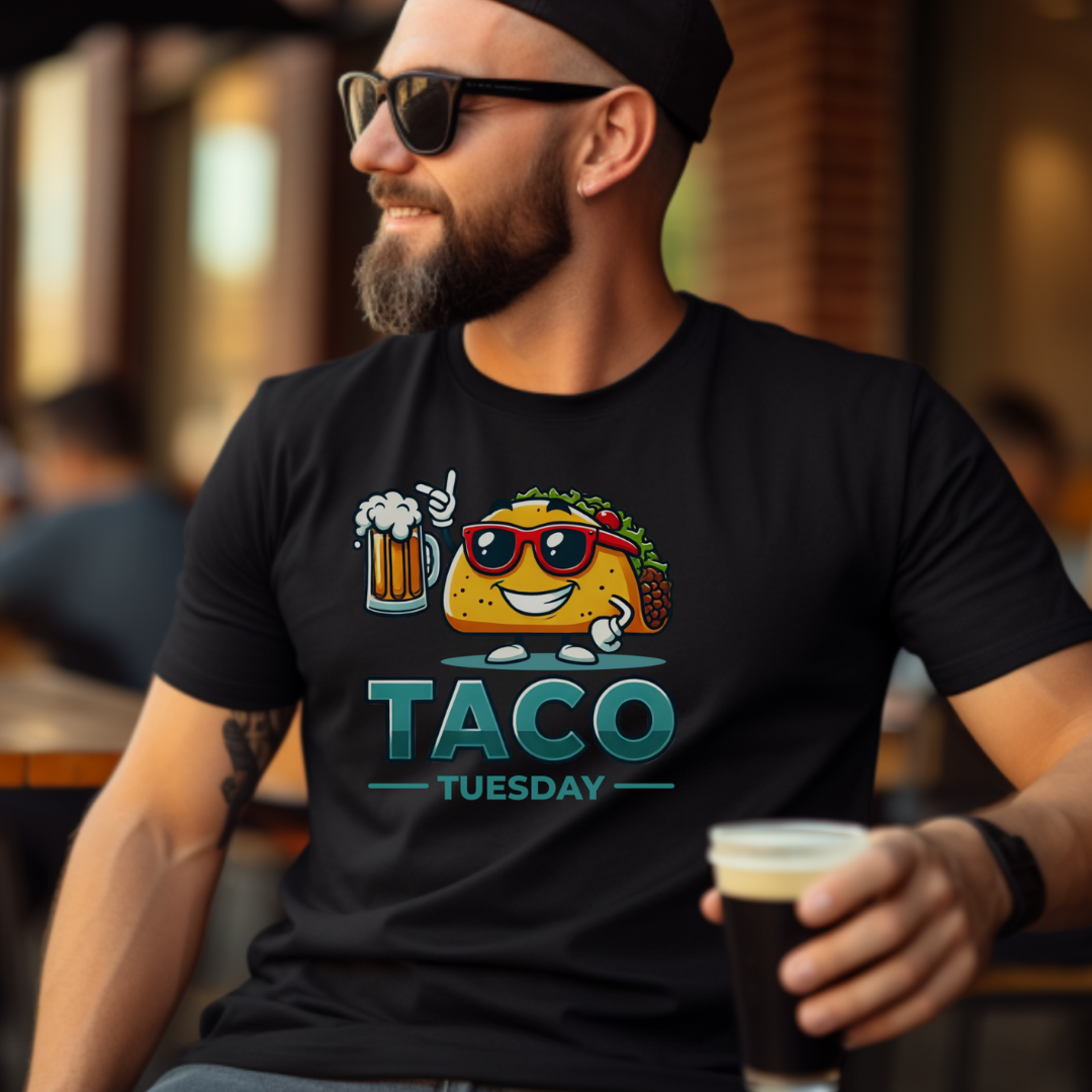 Black 'Taco Tuesday' t-shirt featuring a fun taco character wearing sunglasses and holding a frothy beer mug. Perfect for celebrating Taco Tuesday in a playful, foodie-inspired style.