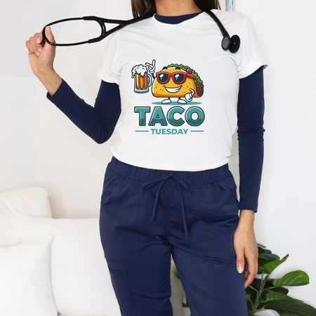 White 'Taco Tuesday' t-shirt featuring a fun taco character wearing sunglasses and holding a frothy beer mug. Perfect for celebrating Taco Tuesday in a playful, foodie-inspired style.