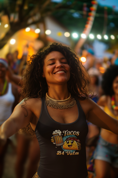 Woman wearing a 'Tacos B4 Vatos' tank top featuring a cheerful taco character with a beer mug, enjoying a lively outdoor celebration. Perfect tank top for taco lovers who want a fun and festive vibe.